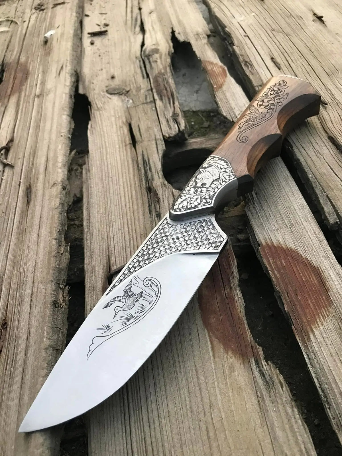 Handmade hand engraved skinner knife with bird design and carved wood handle - full view