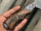 Carved wood handle and engraved silver bolster detail on skinner knife