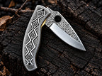 Brass liner and liner lock detail on hand engraved folding knife