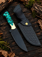 Handmade black powder coated D2 steel skinner knife with green pinecone resin handle, brass bolsters and black Italian leather basket weave sheath