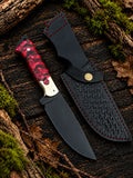 Handmade black powder coated D2 steel skinner knife with red pinecone handle, brass bolsters and black Italian leather sheath with red stitching