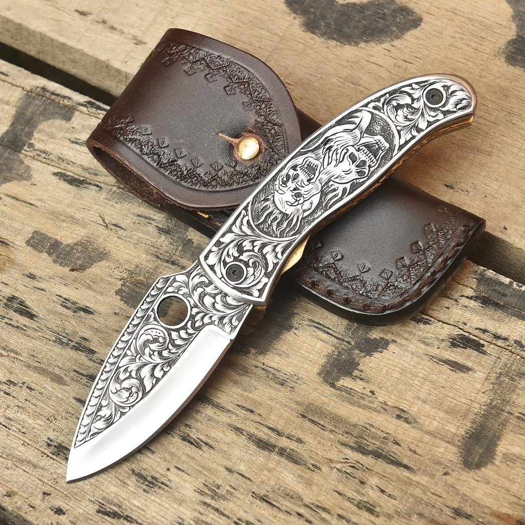 Gothic skull engraved knife blade detail