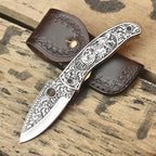 Gothic skull engraved knife blade detail