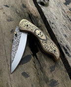 Skull folding knife open, blade detail
