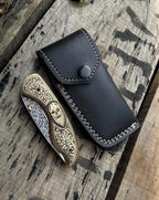 Skull handle knife blade edge detail